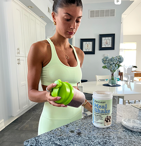 Woman holding a shaker during morning rush