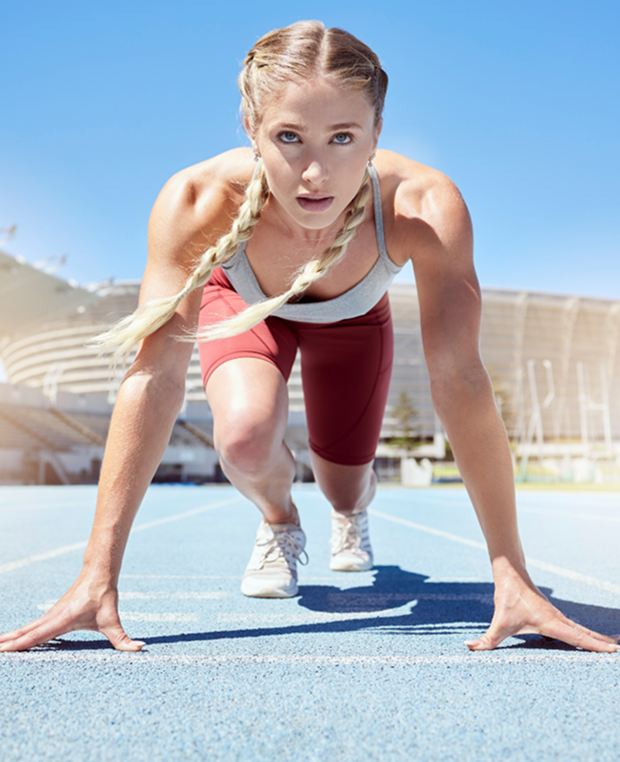 Athlete in starting position on a track