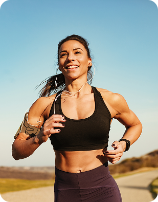 Woman running outdoors with earphones