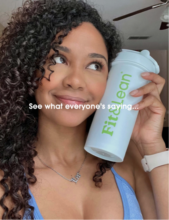 Customer holding Fit and Lean Meal Shake